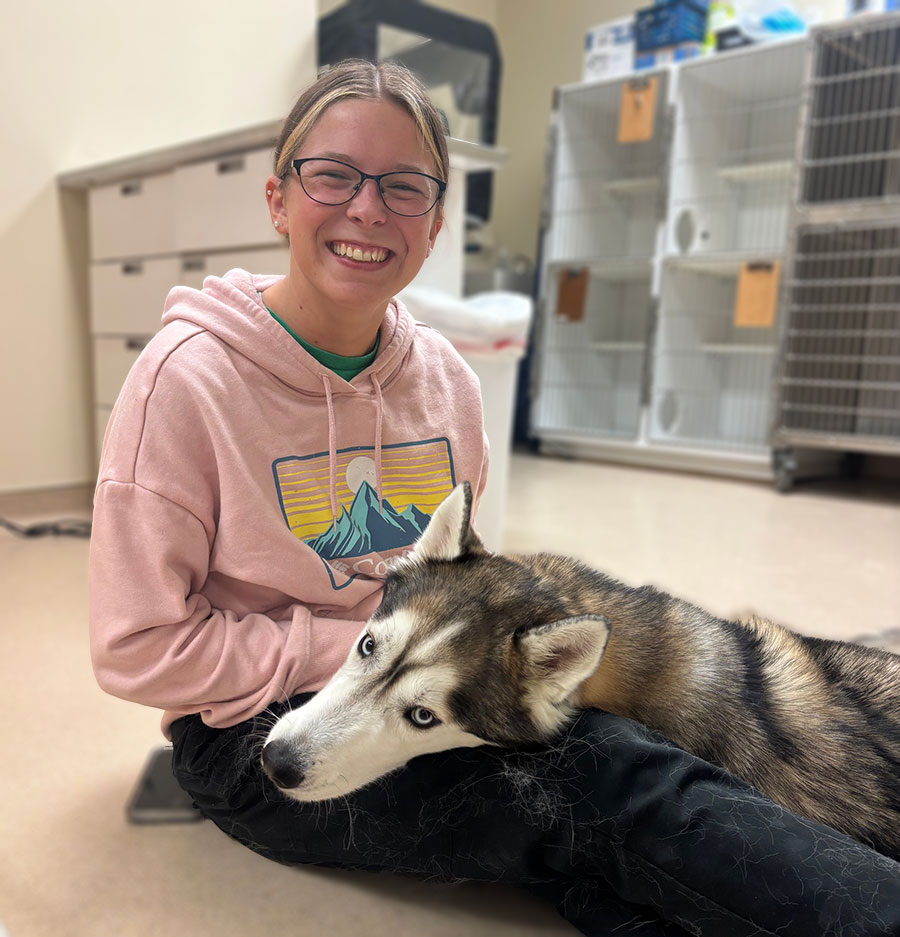 AAHA Covington animal hospital - vet tech with dog